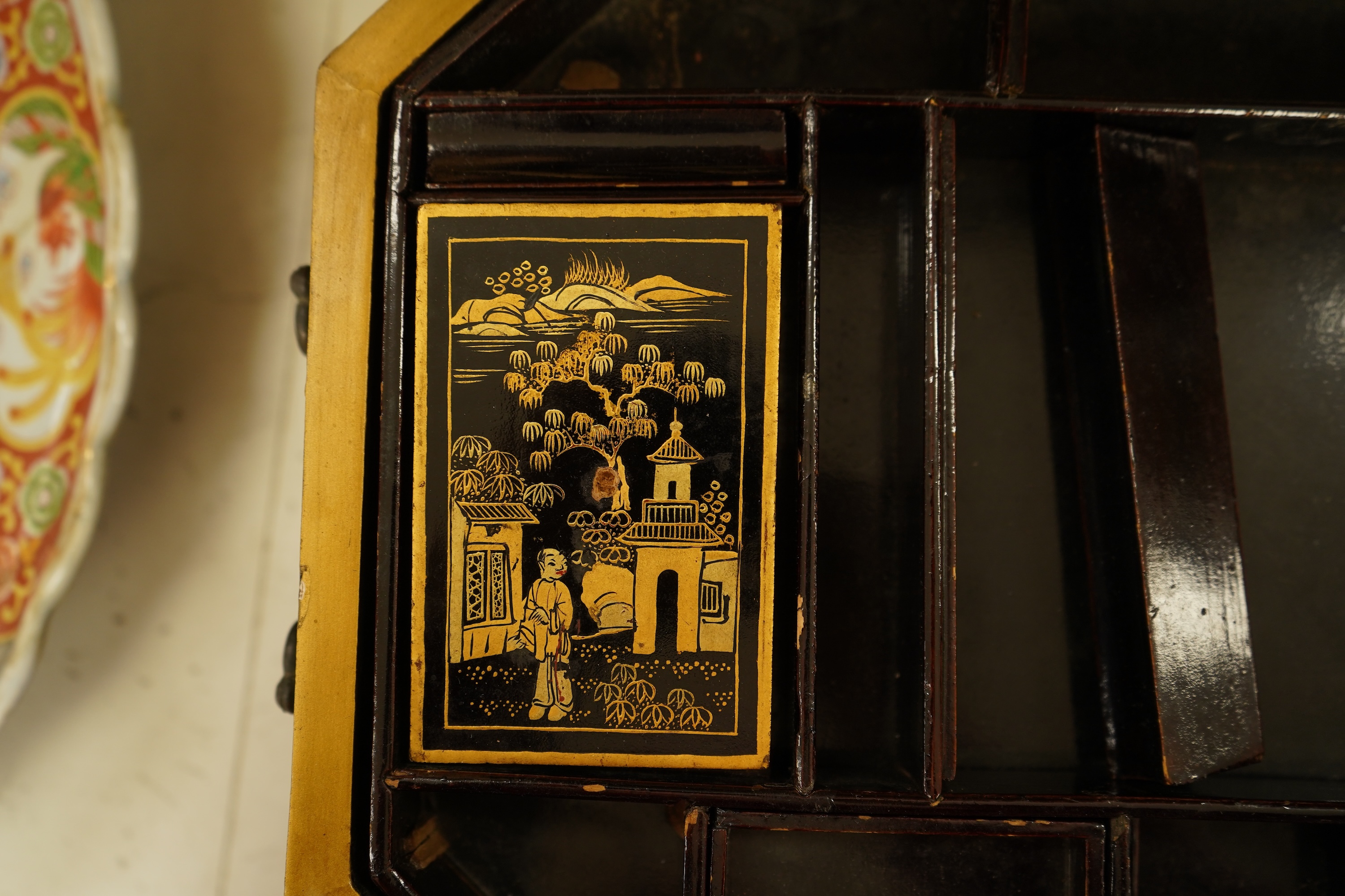 A Chinese export octagonal lacquered work box with fitted interior, 35cm wide